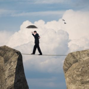 Man balancing on tightrope